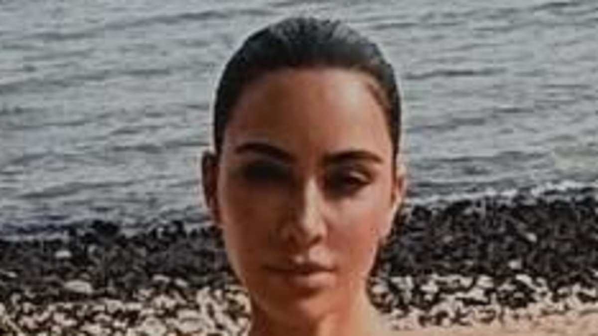 Kim Kardashian brushes aside son Saint's hacking drama as she rocks skimpy bikini on beach trip