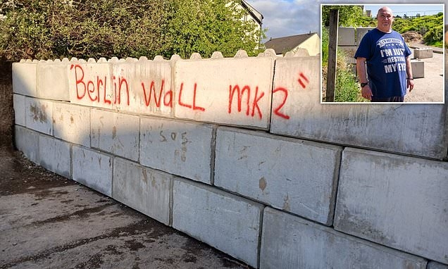EXCLUSIVE The Great Wall of Devon! Inside landowner's battle with neighbours and council after building six foot concrete barrier to block locals