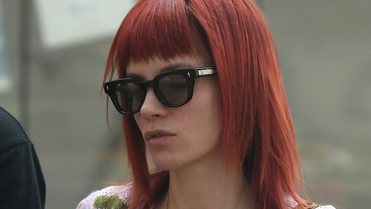Braless Lily Allen shows off her new boob job in a see-through blue mesh top while celebrating her 40th birthday