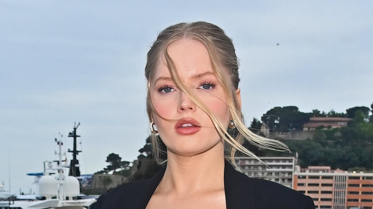 Ellie Bamber shows off her incredible figure in a plunging glitzy bra and suit as she storms the Jaguar 00 launch at the Monaco E-Prix