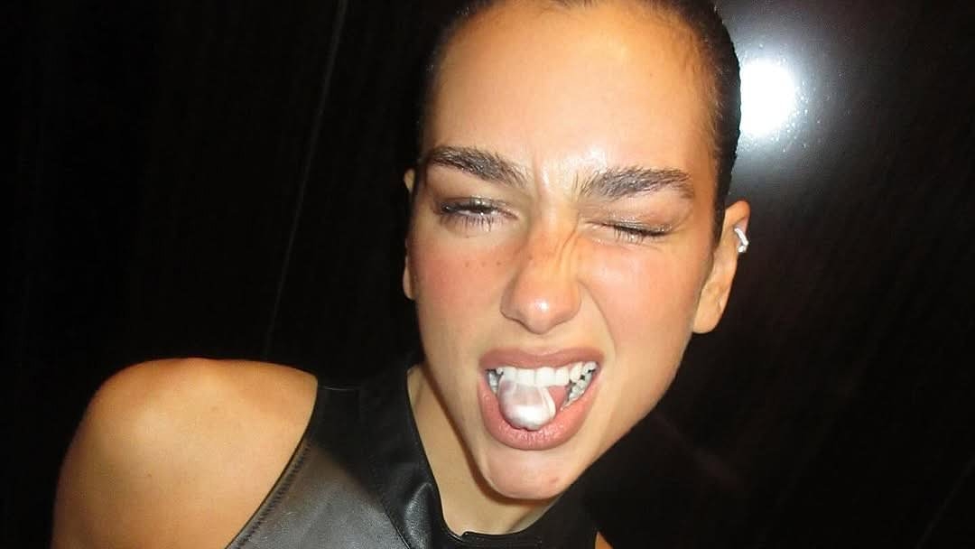 Dua Lipa wows in a black leather minidress and lace up knee high boots as she shares a glimpse into New York City trip with fiancé Callum Turner