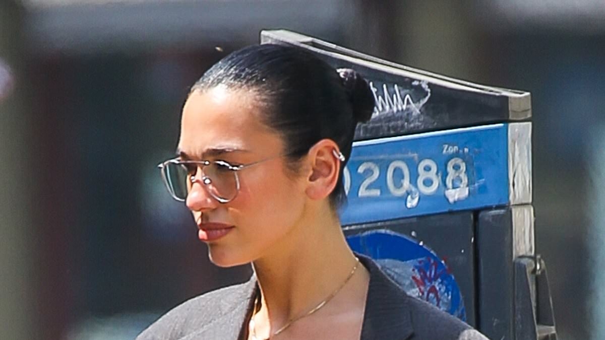 Dua Lipa flashes her underwear under a nude sheer skirt as she shows off her toned legs for a date with fiancé Callum Turner in Manhattan