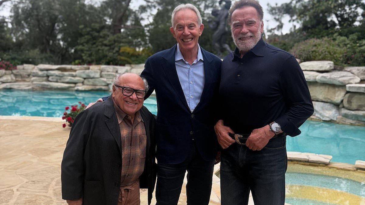 Arnold Schwarzenegger sends fans wild as he reunites with Twins co-star Danny DeVito for new photo - which 'randomly' features former PM Tony Blair