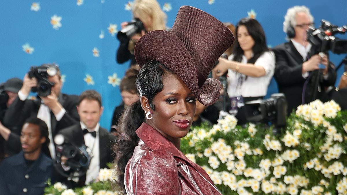 Jodie Turner-Smith stuns at the Met Gala in red leather dress and a statement top hat