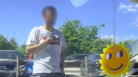 Moment pedestrian refused to move in car park stand-off with driver 'as he tried to save space for his own family who were "miles away"'