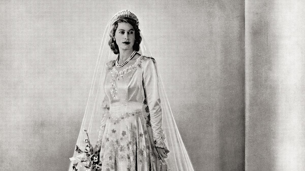 How 10,000 tiny pearls were secretly brought to the UK for Queen Elizabeth's wedding dress