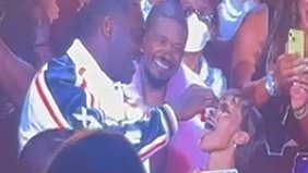 EXCLUSIVE Idris Elba, 52, puts on a very steamy display with wife Sabrina, 35, as he feeds the model cherries during wild Usher concert in London