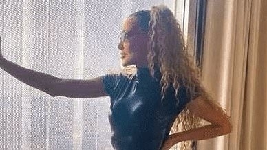 90s pop star, 55, hasn't aged a day as she poses in racy leather catsuit - but can you guess who she is?