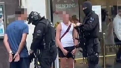 Moment armed police and force helicopter swoop on young men caught playing with water pistols outside Wetherspoons