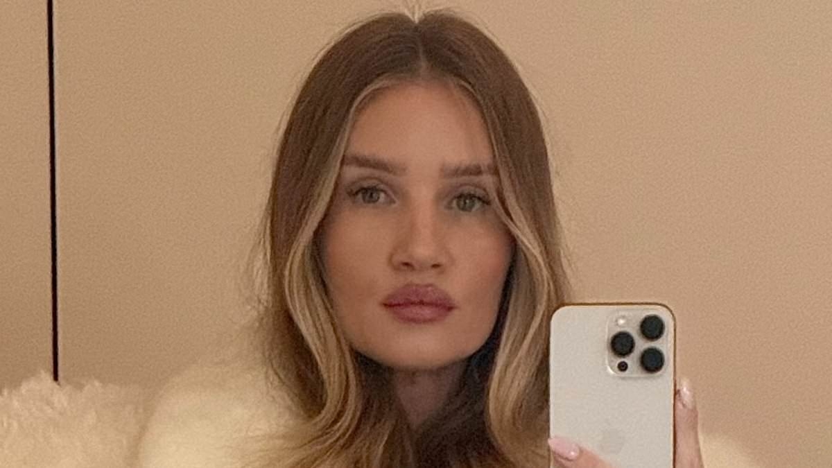 Rosie Huntington-Whiteley looks effortlessly chic in a cream faux-fur coat after hitting the gym