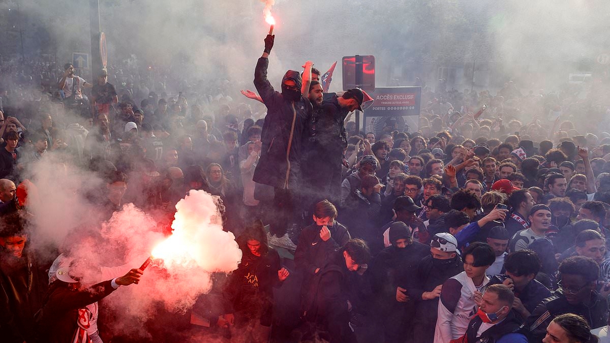 BREAKING NEWS Paris Saint-Germain fans 'teargassed in clash with riot police' in the French capital ahead of crunch Champions League tie with Arsenal