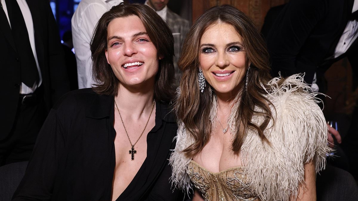 Elizabeth Hurley looks glamorous in a busty gold gown as she brings son Damian - and not new boyfriend Billy Ray Cyrus - as her date to attend charity gala in Germany
