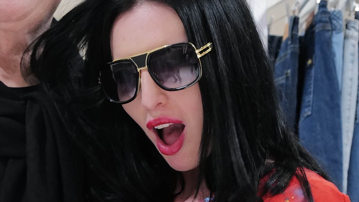 Andrew Sachs's granddaughter Georgina Baillie, 39, makes rare appearance with 1980s rocker boyfriend 28 years her senior at book launch
