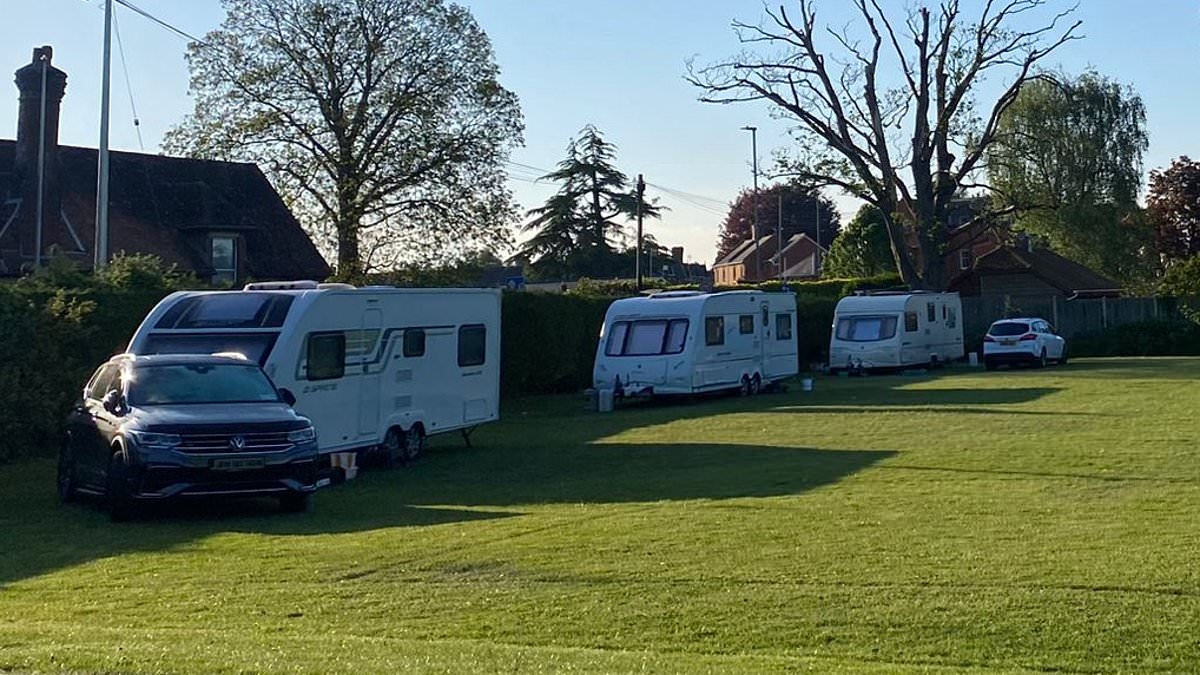 Boy, three, is seriously injured when hit by car towing caravan after travellers set up camp illegally on school playing field