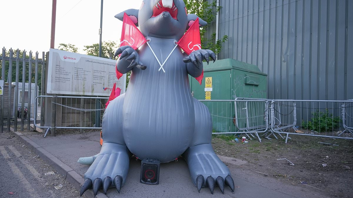Striking Birmingham bin workers blow up giant inflatable rat at 'mega picket' blocking depot in city blighted by rodents and mountains of rubbish as industrial action rumbles on