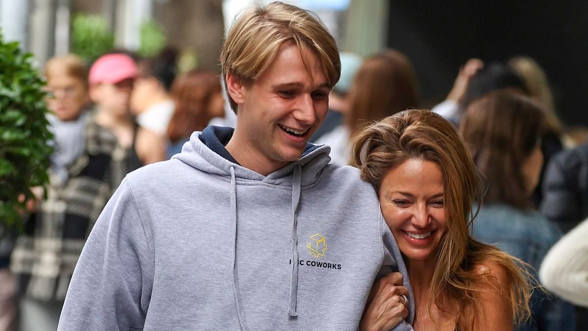 Nude artist Dina Broadhurst shows off her trim pins in a tiny skirt as she enjoys Mother's Day brunch with her son Leo in Sydney