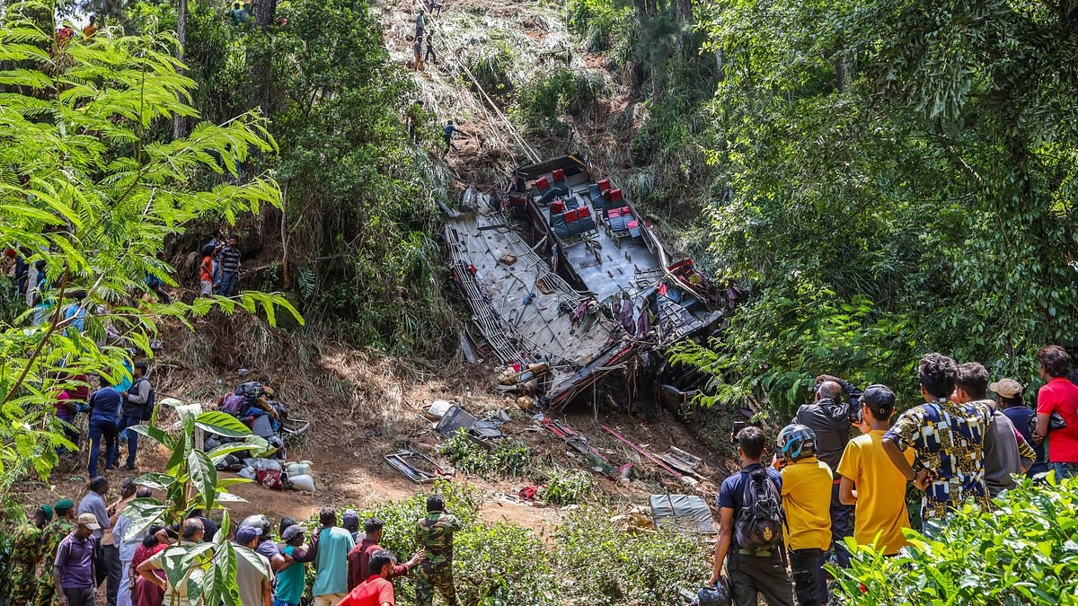 Horror bus crash kills 21: Overcrowded bus 'carrying Buddhist pilgrims' plummets off cliff in Sri Lanka