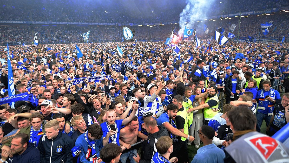 German fans STORM field in mass pitch-invasion with 'at least 25 hospitalised' after fall giants secure Bundesliga return after seven years