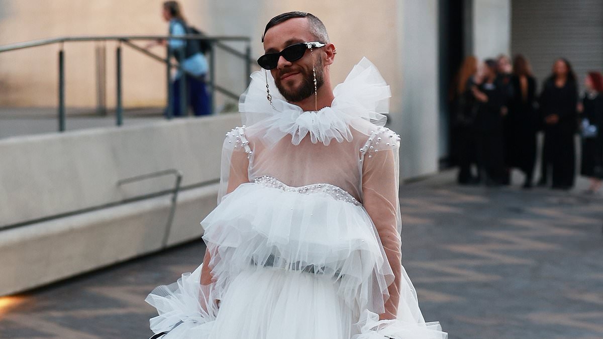 Controversial influencer who was slammed for cringeworthy entrance at last year's Australian Fashion Week returns in 2025 wearing wedding dress held up by four assistants