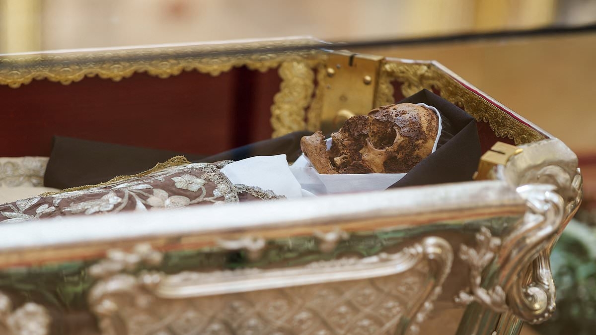Corpse of Saint Teresa goes on display for the first time in a century, just months after her body was deemed 'a miracle' because of how well preserved it is after 440 years