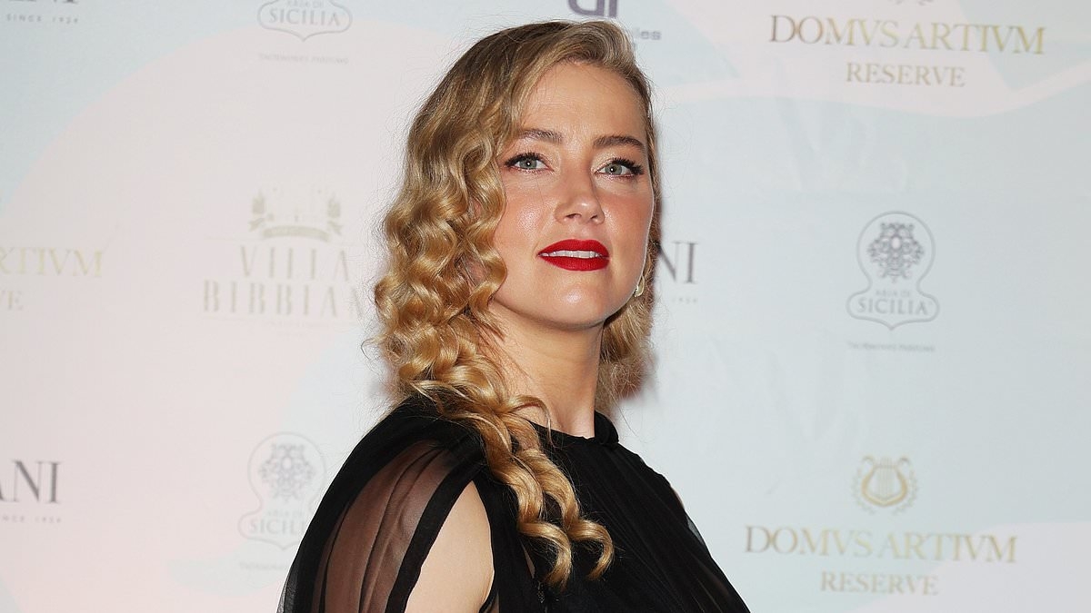 Amber Heard fuels speculation over who father of her twins is as fans guess it's ex Elon Musk