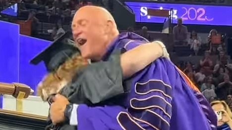 Heartwarming moment Clemson University's president is knocked over by his graduating daughter