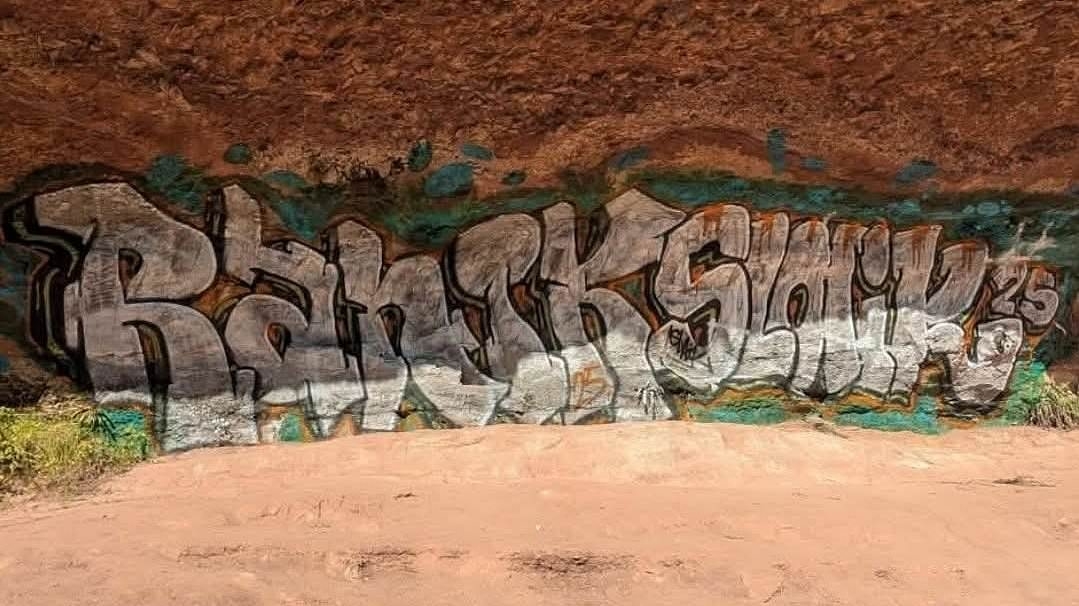 Sacred Aboriginal site defaced with graffiti - sparking a manhunt for the 'entitled' vandals in outback town