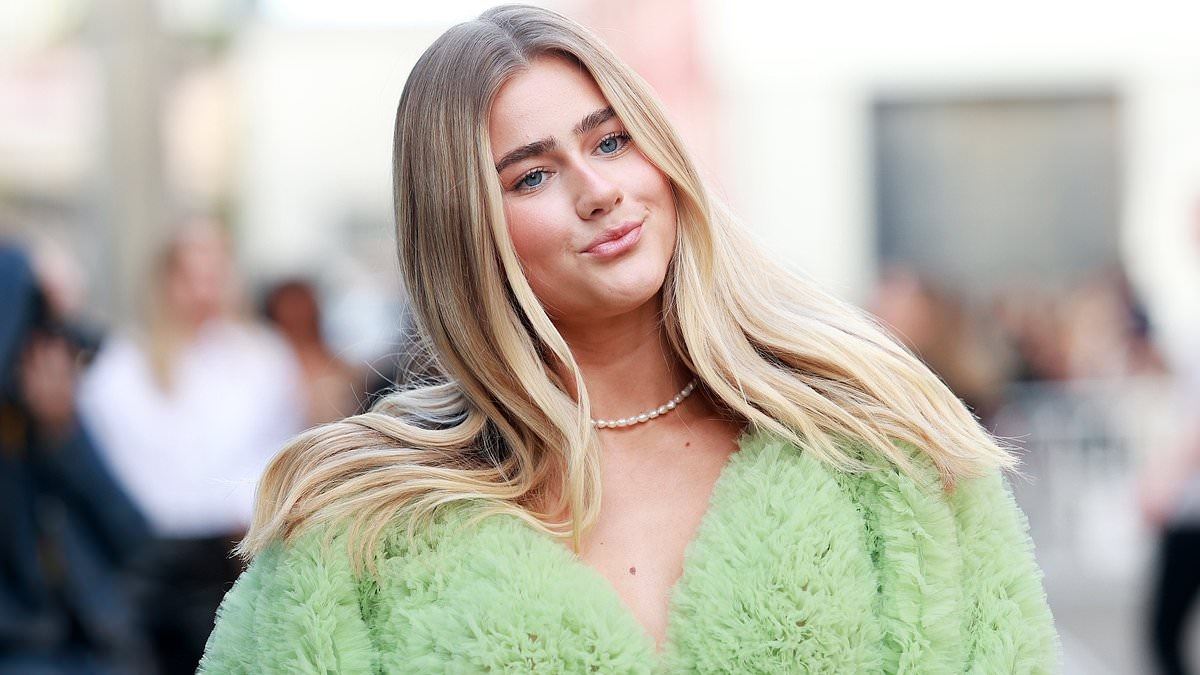 TikTok star Sopha Dopha bares her ripped abs at Australian Fashion Week in bizarre lettuce inspired ensemble