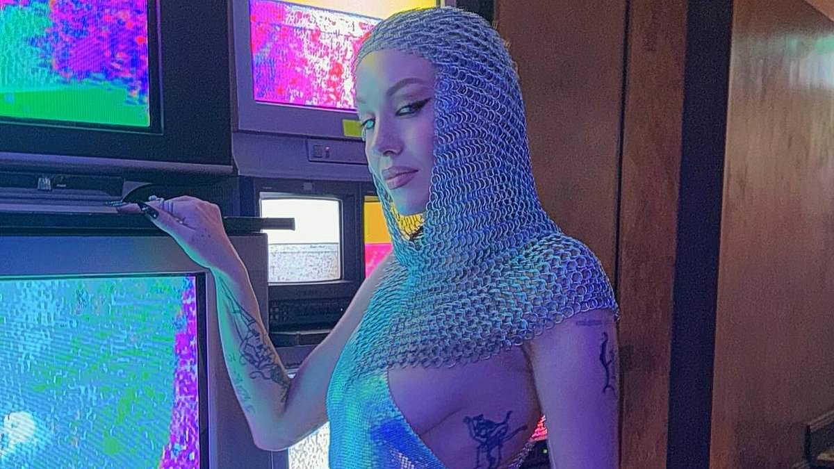 Imogen Anthony risks a major wardrobe malfunction as she dons racy Joan of Arc costume at Australian Fashion Week