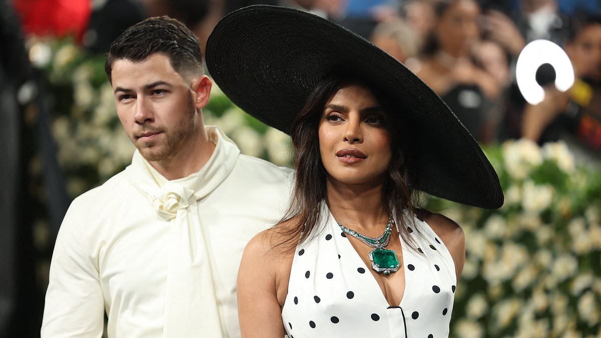 Nick Jonas seems to lose patience with wife Priyanka as her hat overshadows him on the Met Gala red carpet amid fan concern their relationship is on the rocks