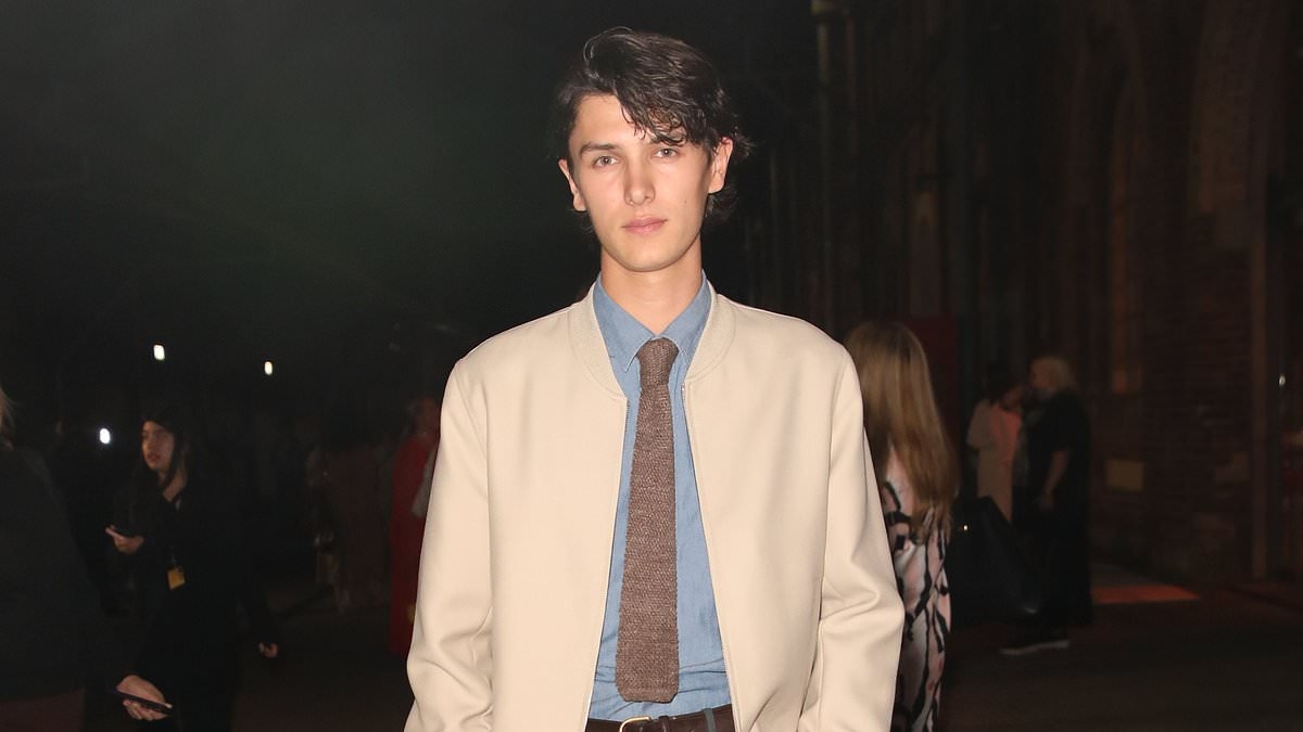 Queen Mary's model nephew Count Nikolai looks dapper in mismatched suit at Australian Fashion Week - after surprise appearance with girlfriend Benedikte Thoustrup