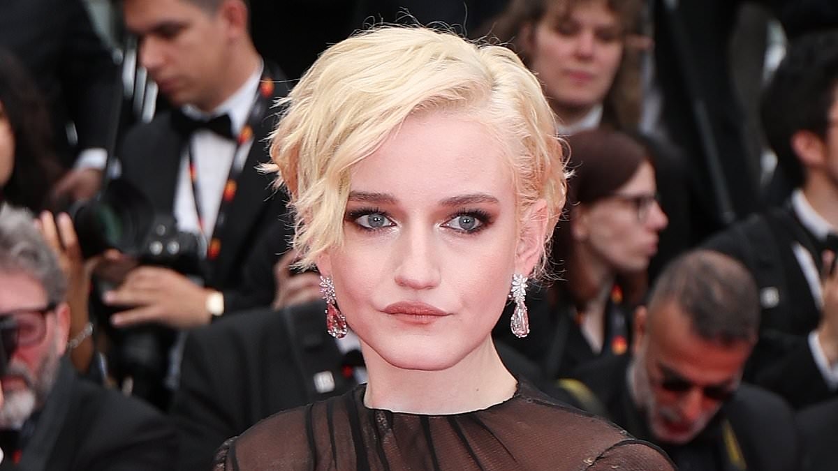 Julia Garner exudes glamour in a sheer black gown as she attends Partir Un Jour screening during Cannes Film Festival opening ceremony