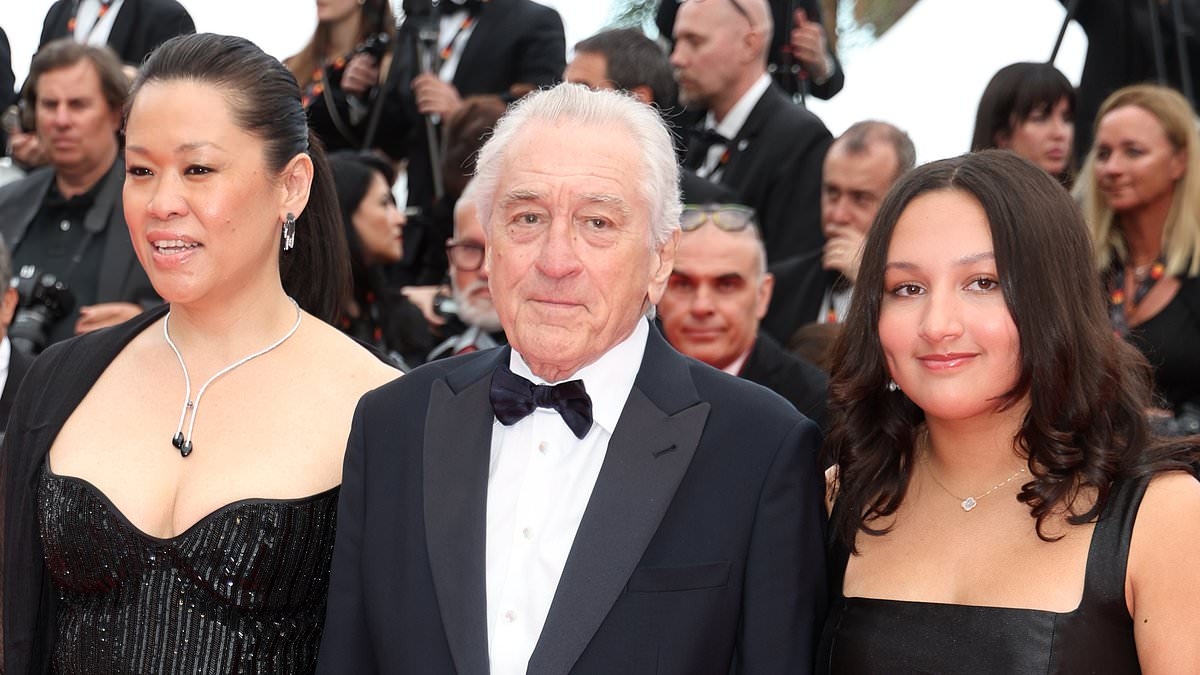 Robert De Niro, 81, looks suave in a black tuxedo as he joins glamorous wife Tiffany Chen, 45, and daughter Helen on the red carpet during Cannes Film Festival opening ceremony