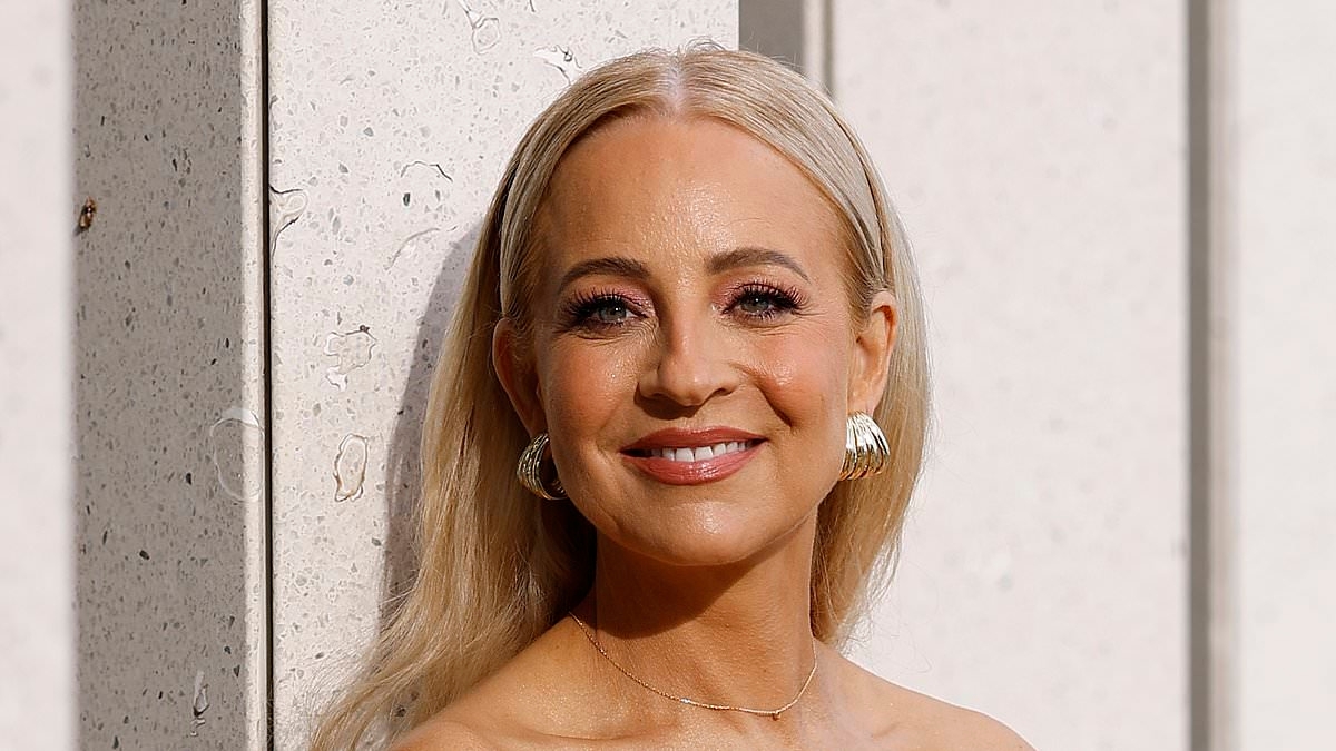 Glowing Carrie Bickmore, 44, looks incredibly youthful she stuns in a floral strapless top at the Aje show during Australian Fashion Week