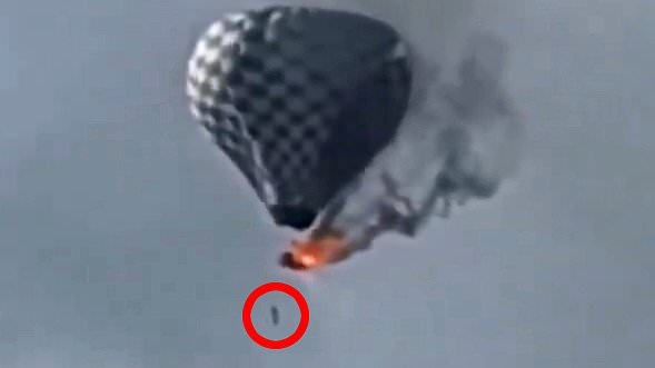 Horror as man falls to his death after dangling from burning hot air balloon
