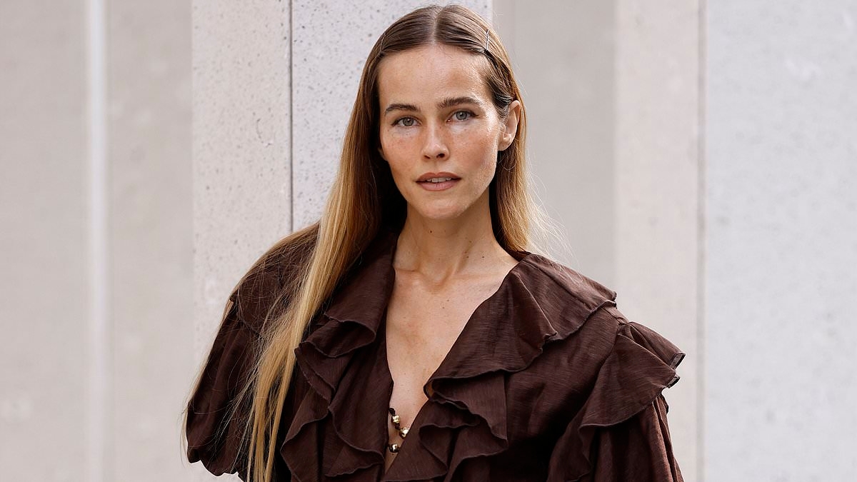 Home and Away star Isabel Lucas shows off slim figure in ethereal frock as she returns to spotlight at Australian Fashion Week following Covid vaccine drama