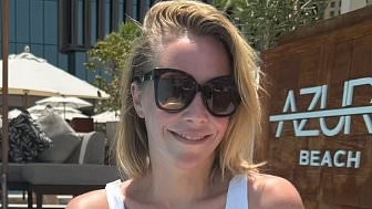 Laura Hamilton, 43, displays her incredible figure as she poses poolside while soaking in the sun at an upscale Dubai resort