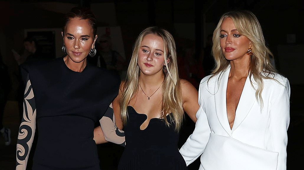 Pip Edwards shows off her trim pins in leather boots while bestie Jackie Henderson goes braless at ex Dan Single's Ksubi show at Australian Fashion Week