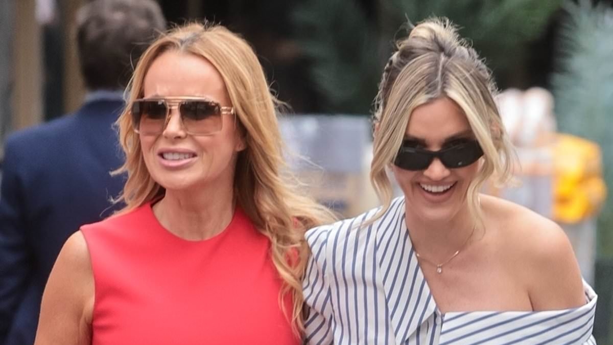 Amanda Holden goes braless in a form-fitting red midi dress as she joins abs-flashing Ashley Roberts to celebrate their Heart Radio win