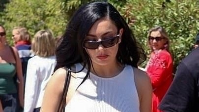 Charli XCX puts on a leggy display in a white mini dress while Shanina Shaik flaunts her toned pins as they step out on day three of Cannes Film Festival