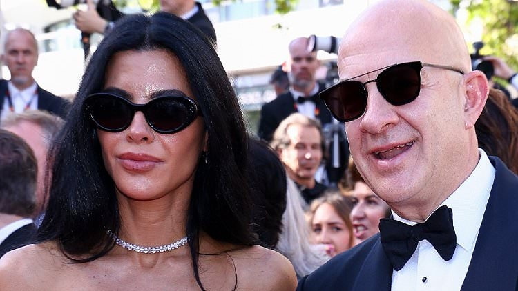 World famous couple storm the Cannes red carpet... but there's just one problem