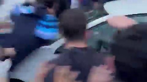 Shocking moment a car ploughs into huge crowd of football fans near stadium before Barcelona derby clash