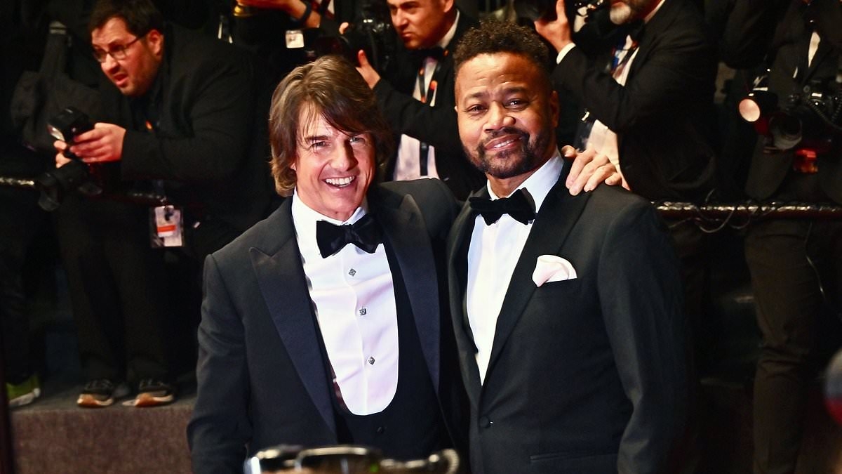 Tom Cruise reunites with his Jerry Maguire co-star Cuba Gooding Jr. on the Cannes red carpet