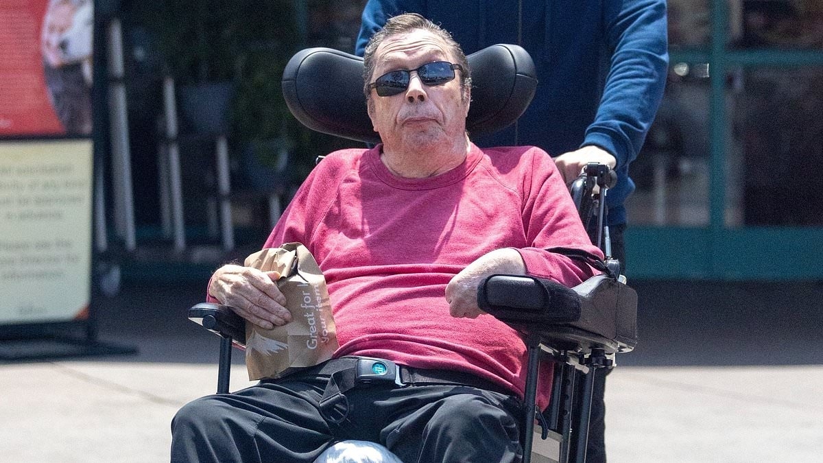 Rocky Horror star Tim Curry seen in rare outing in Los Angeles 13 years after suffering life-changing stroke