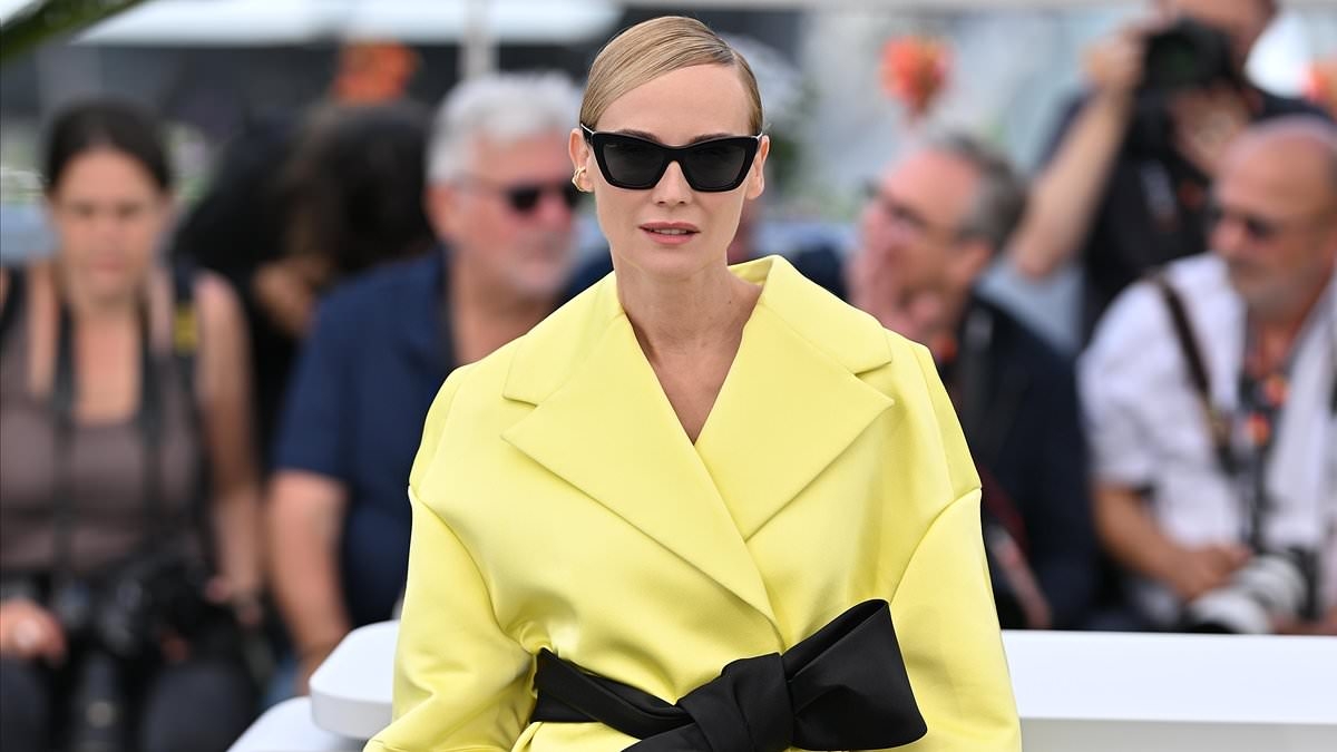 Diane Kruger puts on a leggy display in a yellow kimono dress at Cannes Film Festival's Amrum photocall