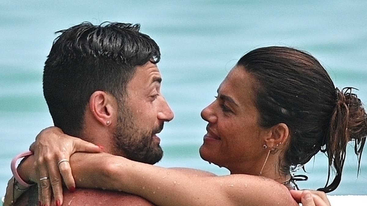 Ex Strictly star Giovanni Pernice looks smitten with bikini-clad girlfriend Bianca Guaccero as they enjoy another romantic beach day in Barbados