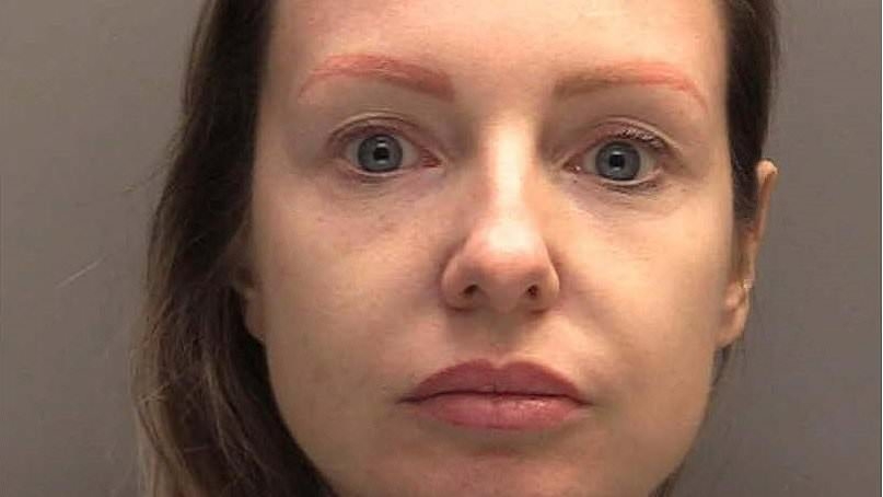 Moment prison governor is arrested by police as she's jailed for relationship with drug boss who she released early