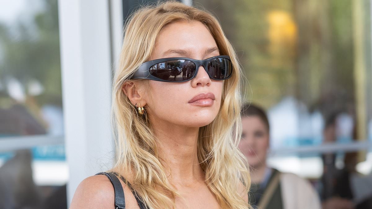 Stella Maxwell turns up the heat in a bra-flashing lace crop top and leather trousers as she steps out on day five of the Cannes Film Festival