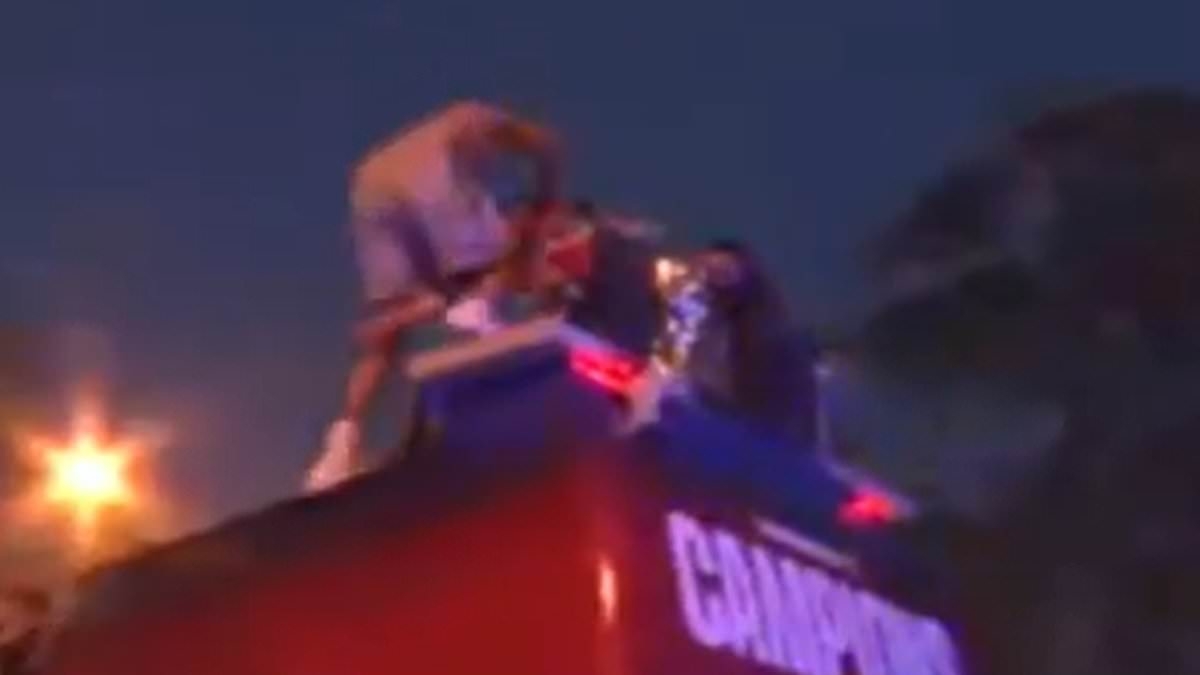 Barcelona star suffers heavy FALL on party bus roof during LaLiga title celebrations - and takes a Man City target down with him!