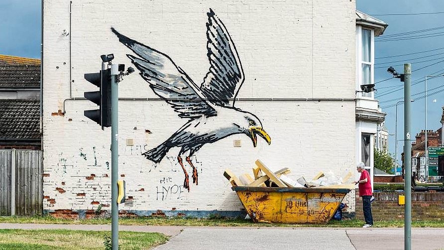 We woke up to find a Banksy on our house - we thought it would make us millionaires but it's cost us £400,000 and we wish he had never bothered